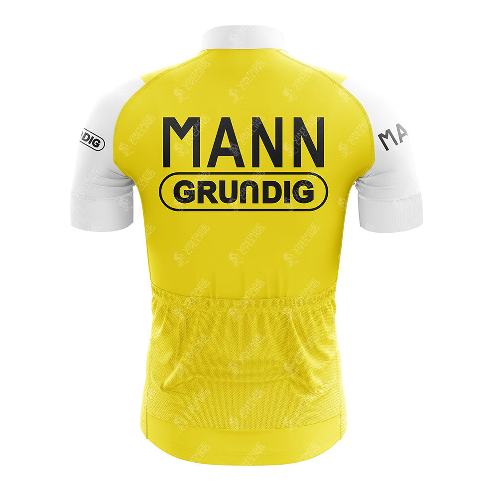 The Sem-France Loire Retro Short Sleeve Cycling Set features a yellow design with white sleeves, "MANN" above "GRUNDIG" in black on the back, and small sleeve logos—blending classic retro style with modern comfort.