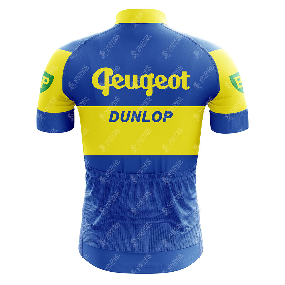 The Reynolds Aluminio Blue Retro Short Sleeve Cycling Set features a blue and yellow breathable design with blue Peugeot, yellow Dunlop, and green/yellow BP logos on the back and sleeves for a classic retro look.