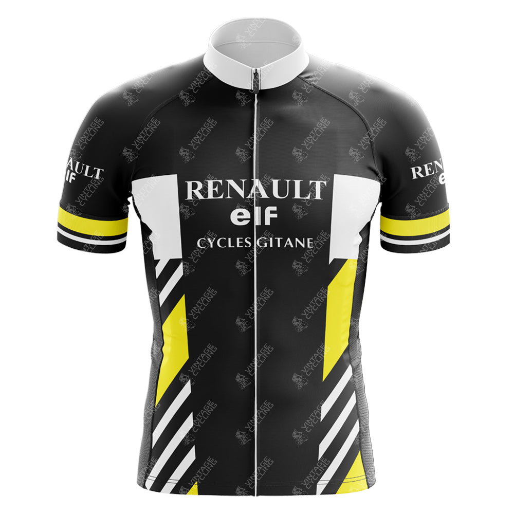 The Renault Elf Mens 1981 Retro Black Cycling Jersey boasts a black, white, and yellow geometric design with RENAULT elf and CYCLES GITANE logos. Featuring a full-length front zipper and short sleeves with black cuffs and yellow stripes, this jersey is ideal for any cycling enthusiast.