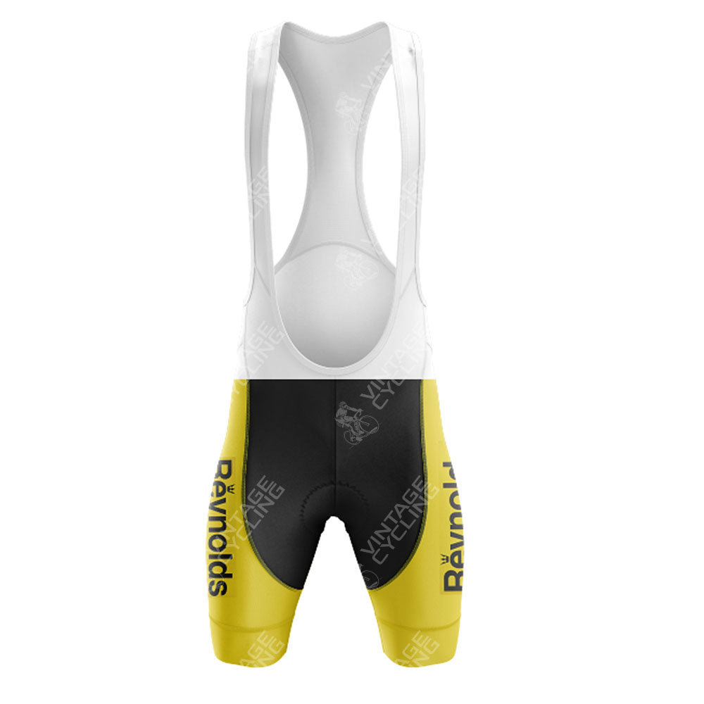 The Del Tongo-MG Maglificio Retro Short Sleeve Cycling Set features bib shorts with white straps, a black midsection, and bright yellow leg panels with “Reynolds” printed vertically—ideal for matching with your favorite retro cycling gear.