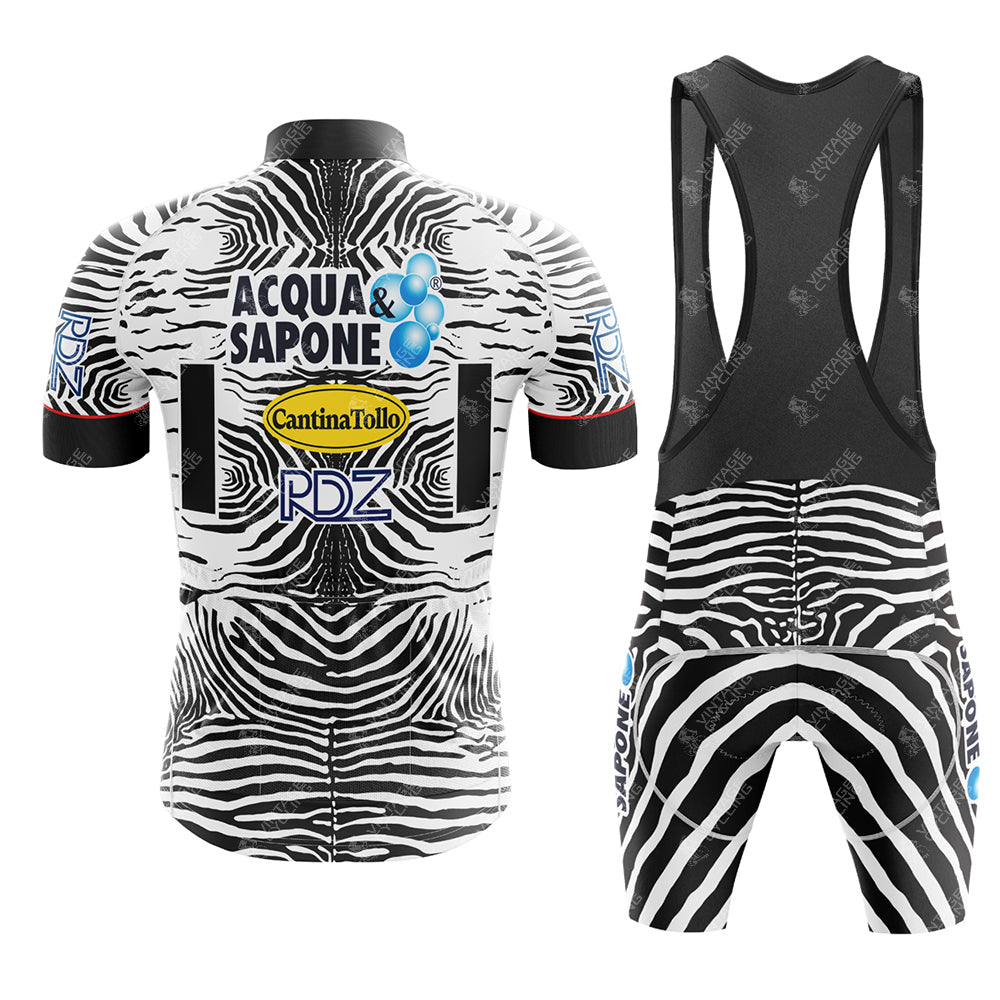 The Acqua Sapone Cantina Tollo Zebra Retro Cycling Jersey Set features a zebra-print pattern with coordinating bib shorts, logos like Acqua Sapone Cantina Tollo and PDZ, stylish blue bubble designs, and a striking black, white, and blue color palette.