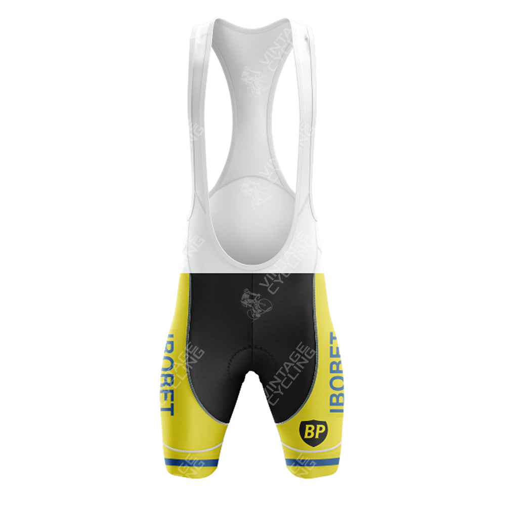 The Maes-Pils Rokado Retro Cycling Set features yellow and black bib shorts with white shoulder straps, BP and IBORET text, and a Vintage Cycling watermark logo, inspired by the classic Bobet Hutchinson style for a retro flair.