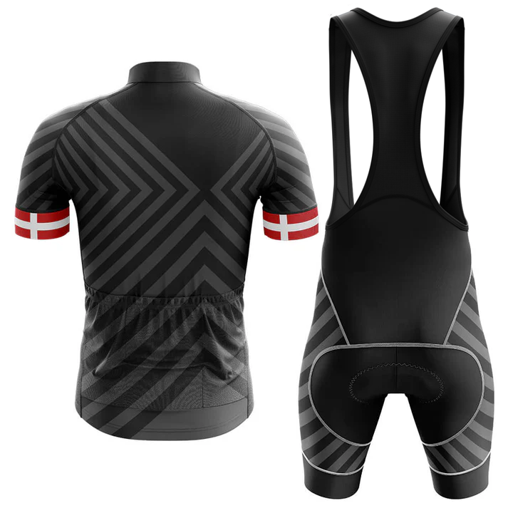 The Therapy Men Short Sleeve Cycling Set is a black Chicago flag kit with moisture-wicking jersey and bib shorts, featuring geometric gray patterns. The short-sleeved jersey has red bands with white crosses on the sleeves. Both back views are shown.