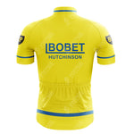 The Maes-Pils Rokado Retro Short Sleeve Cycling Set is a vintage-style yellow jersey with BOBET HUTCHINSON text in blue on the back, featuring BP patches on the sleeves and blue stripe accents on both the sleeves and waist.