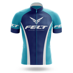 The Sugar Skull Men Short Sleeve Cycling Set features a blue and teal Chicago flag design, FELT branding and wing logos on the chest and sleeves, front zipper, white accent lines, and pairs perfectly with performance bib shorts.