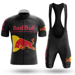 The Red Bull V2 Men Short Sleeve Cycling Set (Copy) is a black cycling jersey and bib short set with red and yellow Red Bull logos on the chest, sleeves, and thigh, shown on a white background.