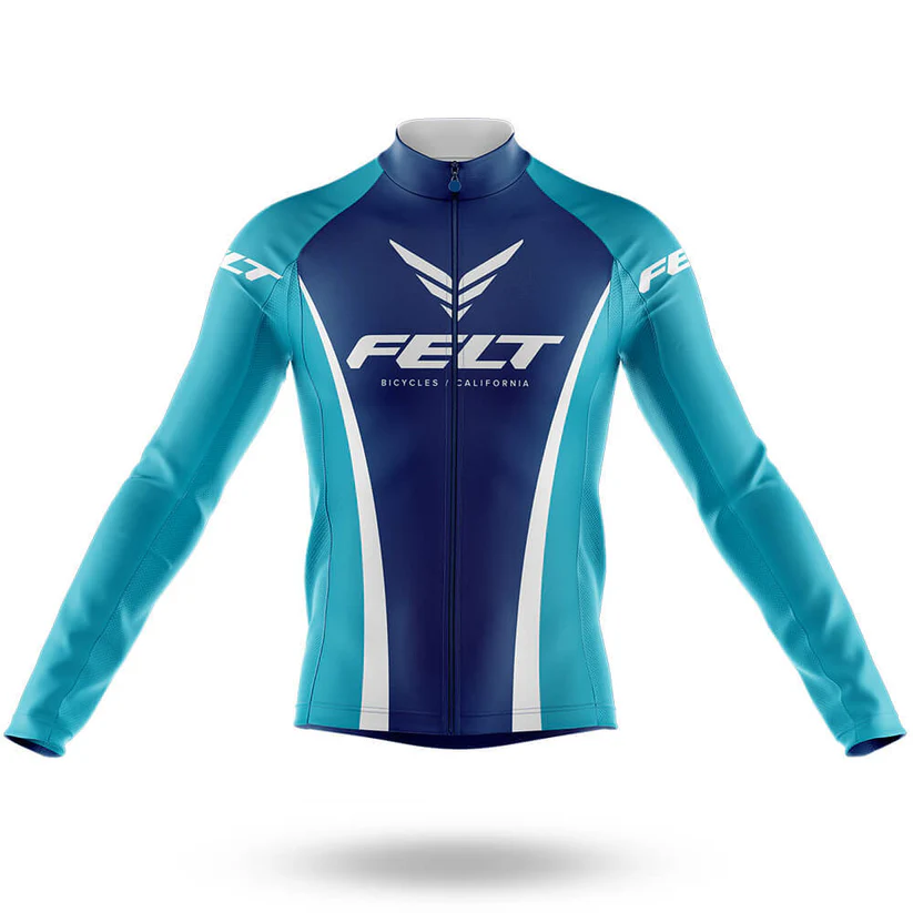 The Believe Men Long Sleeve Cycling Jersey is blue and teal with FELT BICYCLES CALIFORNIA and a winged logo on the chest, FELT on the sleeves, and is shown against a plain white background. Ideal for cool weather rides.