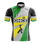 The PDM ULTIMA Retro Short Sleeve Cycling Set features a vintage cycling jersey with a geometric design in black, white, gray, yellow, and green. It showcases ONCE with an abstract figure in motion and short sleeves displaying walking figures and the brand Mavic Look, exuding retro cycling vibes.