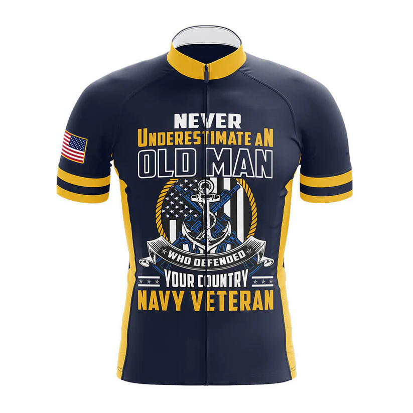The U.S.Navy V3 Men Short Sleeve Cycling Set is navy blue with yellow stripes, a U.S. flag sleeve patch, and the text: Never underestimate an old man who defended your country, plus anchor and American flag graphics.