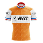 The BIC Orange Retro Short Sleeve Cycling Set pays homage to classic style with its orange and white body, red, white, and blue striped sleeves and collar, featuring the Bic logo. It includes a front zipper for convenience.