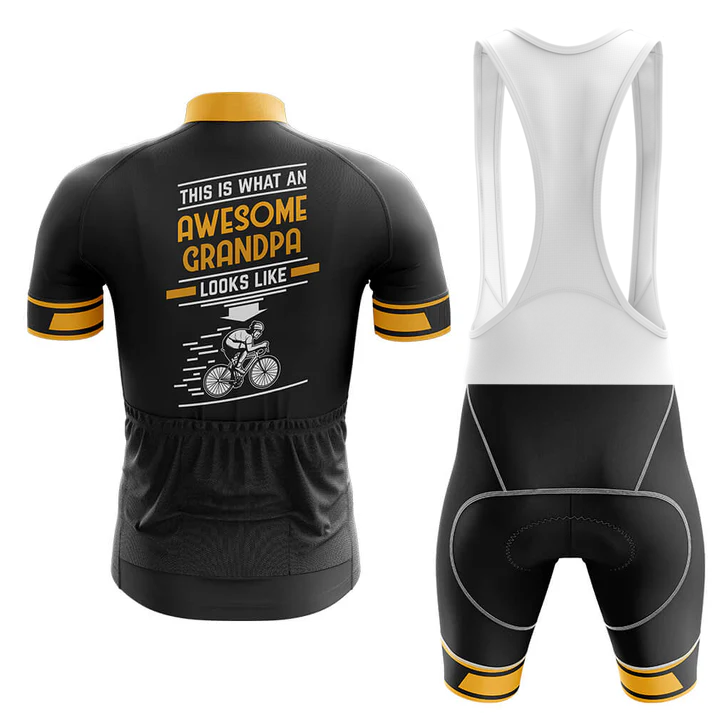 Front and back view of the Scotland Men Short Sleeve Cycling Set in black and yellow. The jersey back says "This is what an awesome grandpa looks like" with a cyclist graphic. Includes moisture-wicking jersey and bib shorts with white straps.