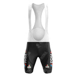 The White Reynolds Retro Short Sleeve Cycling Set features black shorts with white straps, adorned with the PDM ULTIMA logo in white and red. A subtle white pattern enhances the timeless retro aesthetic.