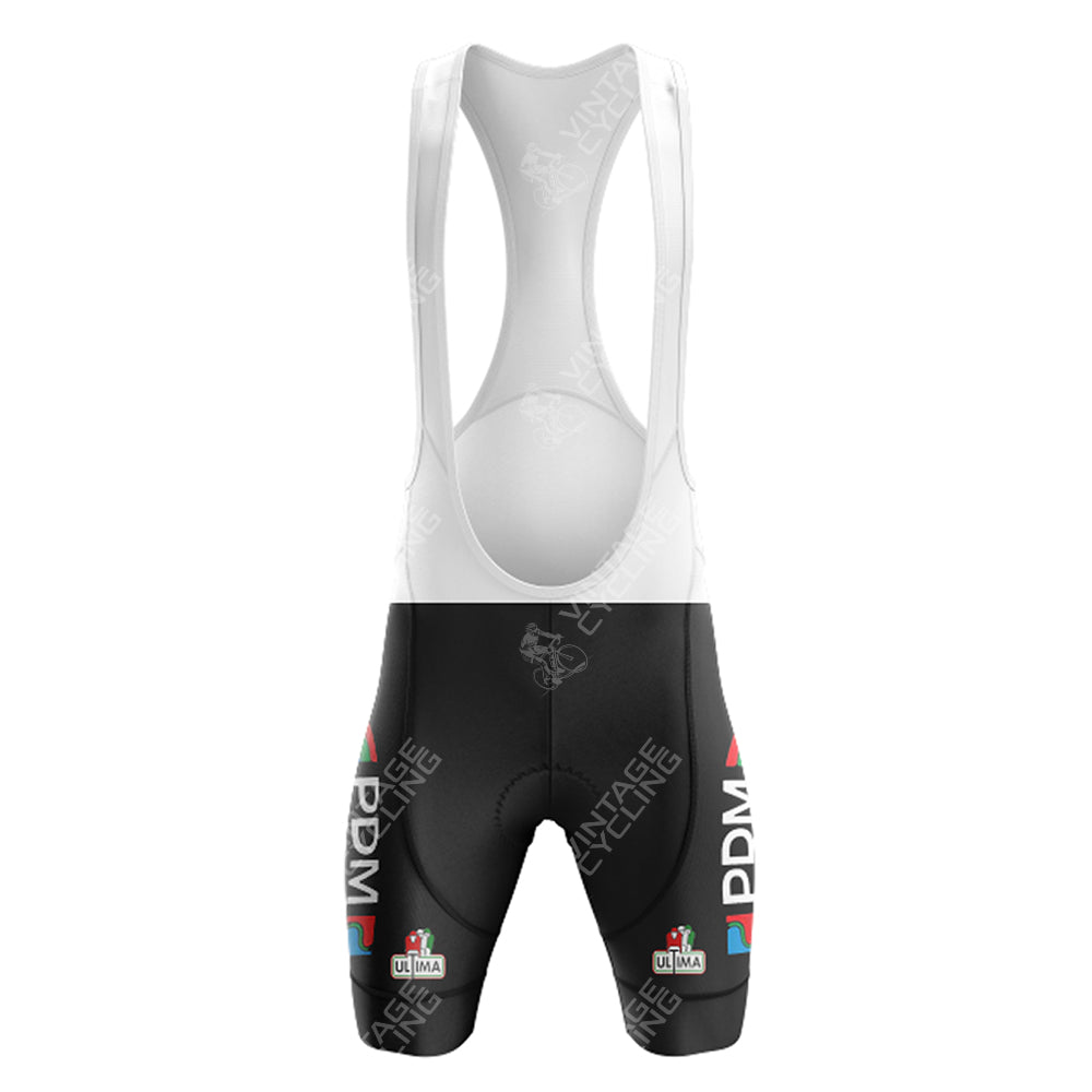 The White Reynolds Retro Short Sleeve Cycling Set features black shorts with white straps, adorned with the PDM ULTIMA logo in white and red. A subtle white pattern enhances the timeless retro aesthetic.