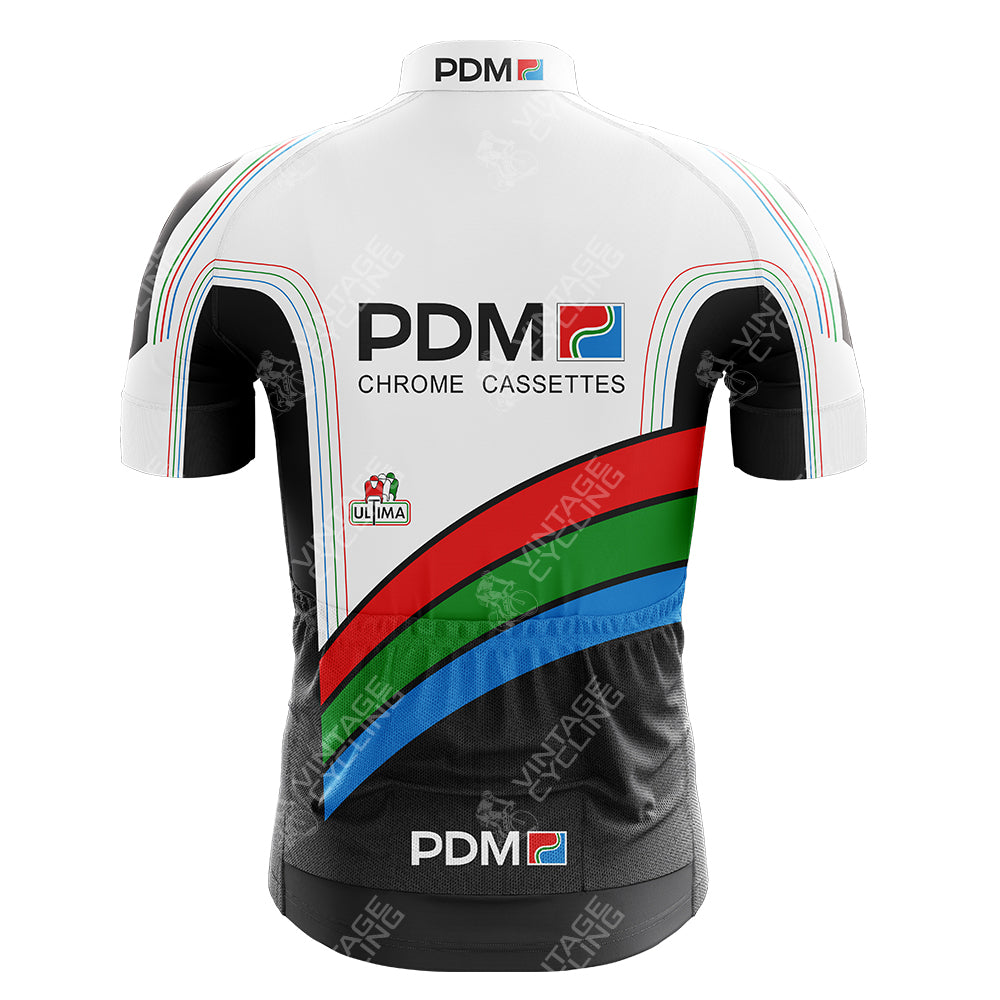 The back of the White Reynolds Retro Short Sleeve Cycling Set displays PDM and Chrome Cassettes text in white, black, green, red, and blue. A small Italian flag logo adorns the sleeve, with retro band patterns on the sides from the PDM ULTIMA collection.