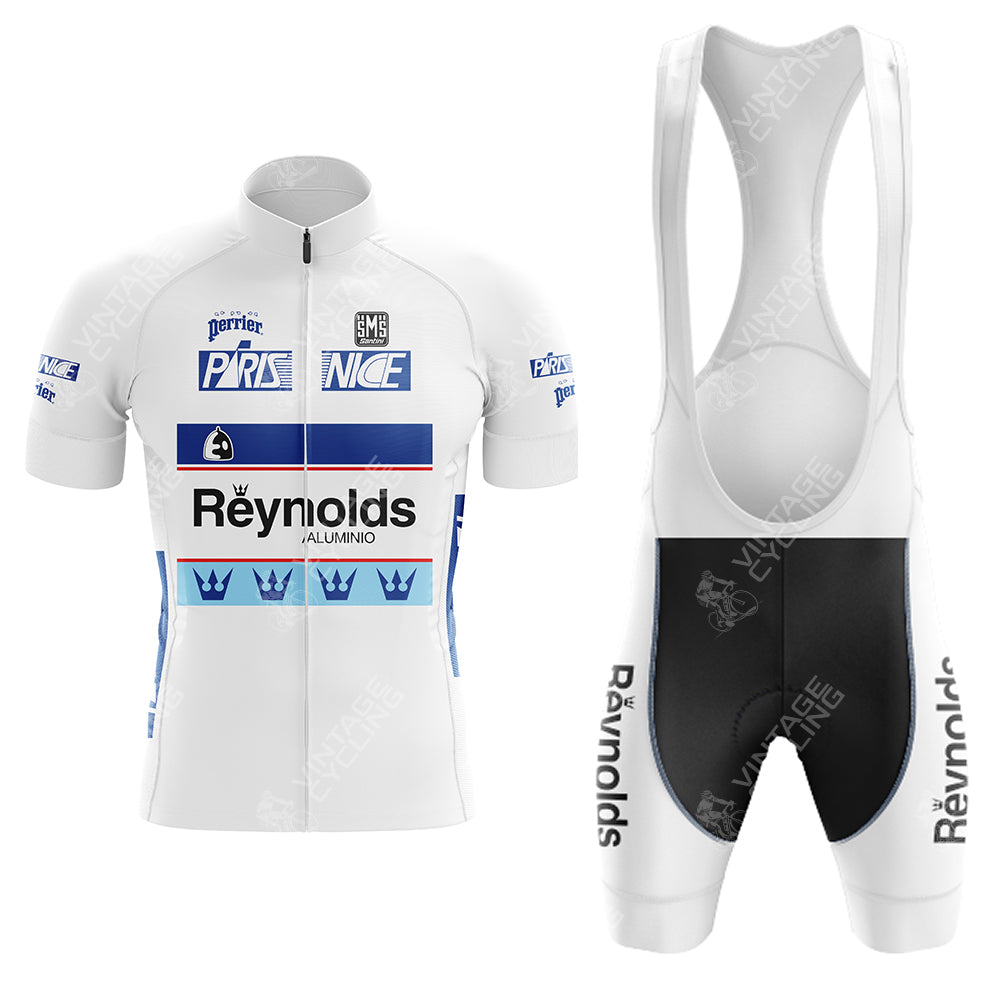 The SCIC Retro Short Sleeve Cycling Set includes a white and blue jersey and bib shorts. The jersey features logos like Reynolds and PRISUNIC with crown designs, while the bib shorts display Reynolds, all capturing a Reynolds retro vibe on a crisp white background.