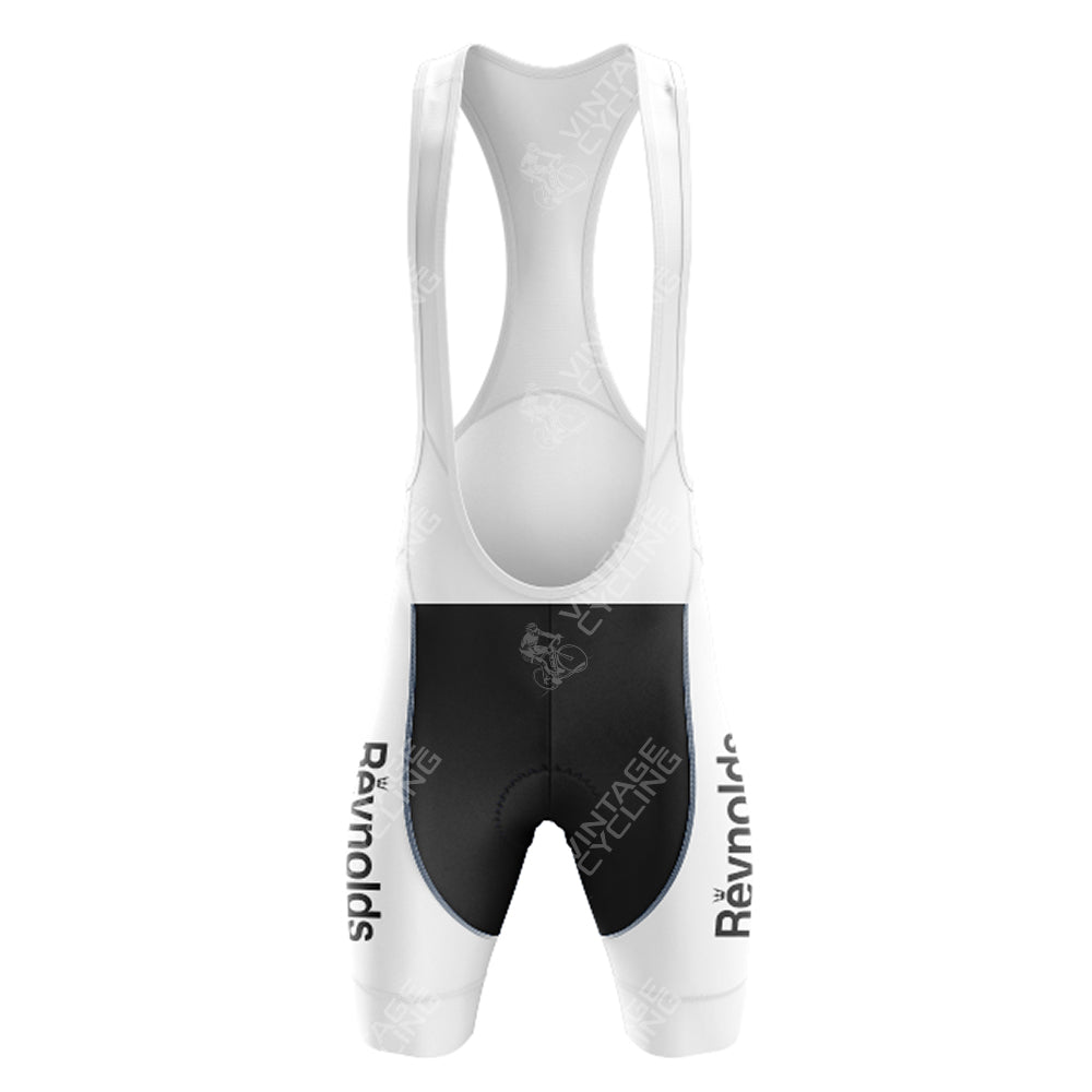 The SCIC Retro Short Sleeve Cycling Set showcases a front view with bib shorts featuring white shoulder straps, black shorts, and the word Reynolds vertically on the sides, all with a sleek aerodynamic design for optimal performance.