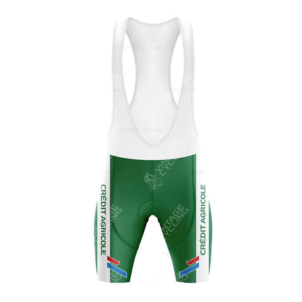 Front view of a green and white cycling set, the CAFE DE COLOMBIA Retro Short Sleeve Cycling Set features bib shorts with white straps and small flag details on the legs, exuding an athletic spirit ideal for both casual and competitive riders.