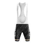 Front view of black MOLTENI bib shorts with white straps; MOLTEN printed vertically on each leg. A strip with orange, white, and green accents lines the lower edge, enhancing the retro look of the MOLTENI Black Retro Short Sleeve Cycling Set.