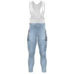 The Bianchi Blue Retro Long Sleeve Cycling Set features light blue bib tights with Bianchi in black on both legs, a white bib section with comfy straps, and a gel seat pad for enhanced riding comfort.