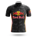 The Iggles Short Sleeve Cycling Set features a black jersey with a subtle camo pattern, bold Red Bull logo on the chest and sleeve, and yellow-red side accents—an ideal addition to any Red Bull cycling collection.