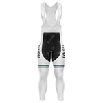 The FYNSEC Retro Long Sleeve Cycling Set features white bib tights with black panels and a FMXSEC logo on the sides, complemented by red and blue knee stripes. Made from smooth, stretchy fabric with shoulder straps and a gel seat pad for added comfort.