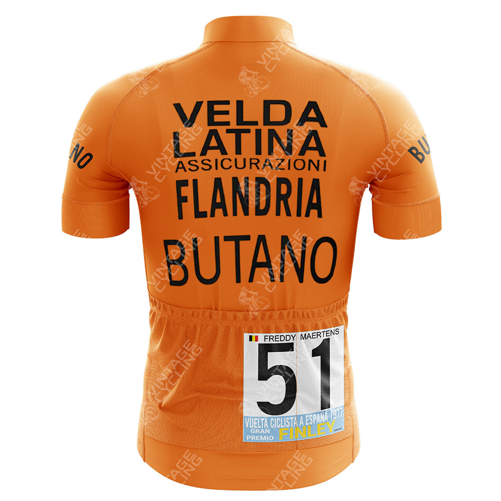 Back view of an orange Gatorade Chateau dAx Retro Short Sleeve Cycling Set featuring black text: Velda, LAtina, Assicurazioni, Flandria, Butano. A race number 51 with Freddy Maertens, Vuelta Ciclista a España 1977 is pinned on the back. Consult our size guide for your perfect fit!.