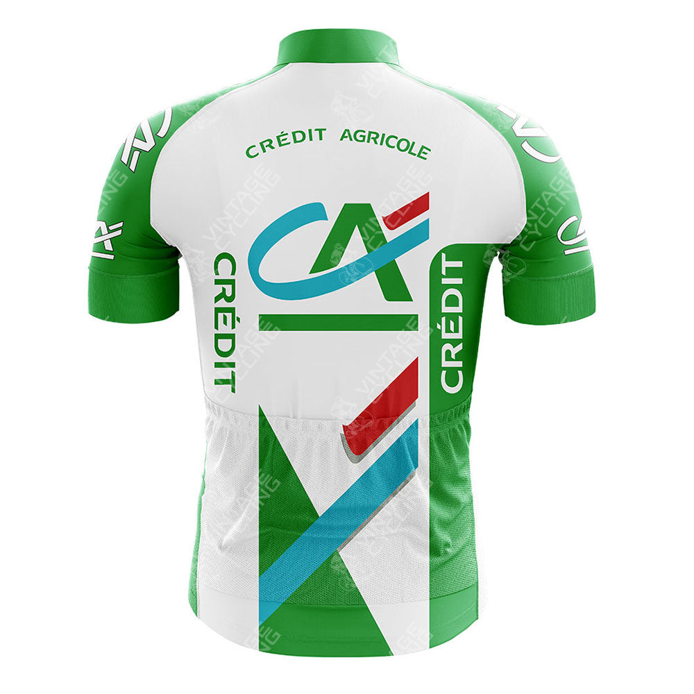 Rear view of a CAFE DE COLOMBIA Retro Short Sleeve Cycling Set in green and white, featuring the Crédit Agricole logo. It has green sleeves, a white back panel, red and blue accents, with CRÉDIT boldly printed both vertically and horizontally.