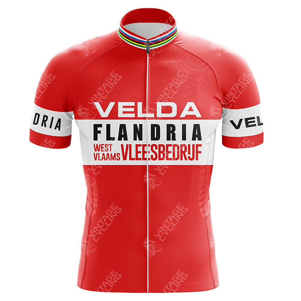 The Z Vetements Enfants Retro Short Sleeve Cycling Set is a red jersey with white horizontal stripes, VELDA and FLANDRIA text in black, WEST VLAAMS VLEE:SBEIDRIJF lettering, and a rainbow stripe detail on the collar.