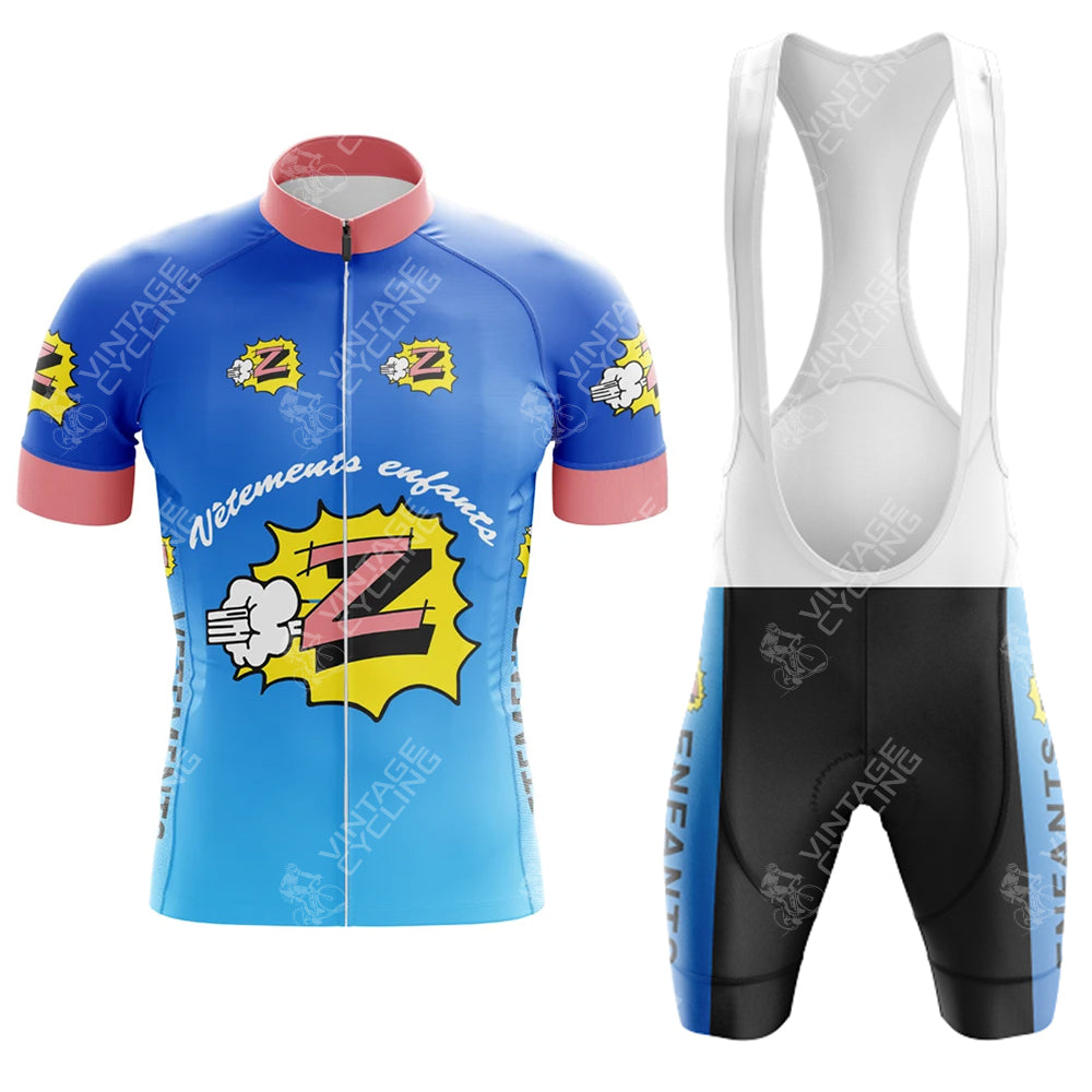 The VELDA LATINA Retro Short Sleeve Cycling Set includes a blue and pink comic-style jersey and matching black bib shorts, featuring playful, colorful motifs and bold patterns.