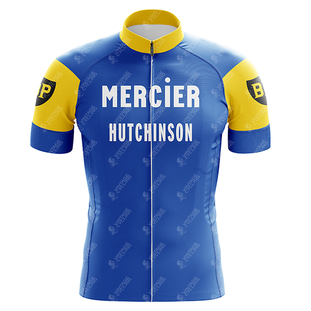 The Mercier Retro Short Sleeve Cycling Set features a blue and yellow cycling jersey with Mercier and Hutchinson on the front, short sleeves with a black and yellow circular BP logo, and a convenient front zipper.