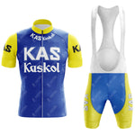 The KAS V2 Retro Short Sleeve Cycling Set includes a blue jersey with yellow sleeves, featuring KAS Kaskol in white, and matching bib shorts. Check our sizing guide for the perfect fit.