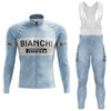 Light blue Bianchi Blue Retro Long Sleeve Cycling Set, showcasing BIANCHI and PIRELLI logos. Includes a front zipper jersey and full-length bib tights with a Gel Seat Pad, featuring black text on white panels for a classic look.