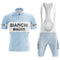 The Bianchi Blue Retro Short Sleeve Cycling Set features a light blue and white kit with BIANCHI and PIRELLI logos in bold black. The set includes a short-sleeved jersey with a front zipper and matching bib shorts.