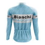 The Bianchi Piaggio Retro Long Sleeve Cycling Set, featuring Bianchi and Piaggio on the back, includes a light blue performance jersey with a white upper-back stripe and three lower back pockets.