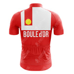 The SUPER Red Retro Short Sleeve Cycling Set features a red jersey with a white square on the back, displaying BOULE dOR in bold. Inside the square is a yellow circle. It combines subtle white branding, style, and function seamlessly.