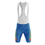 The Castorama Retro Cycling Jersey Set includes bib shorts with white straps, blue fabric, and retro rectangular yellow and red accents. Made of breathable, lightweight polyester, it offers a smooth fit and optimal comfort for athletic activities.