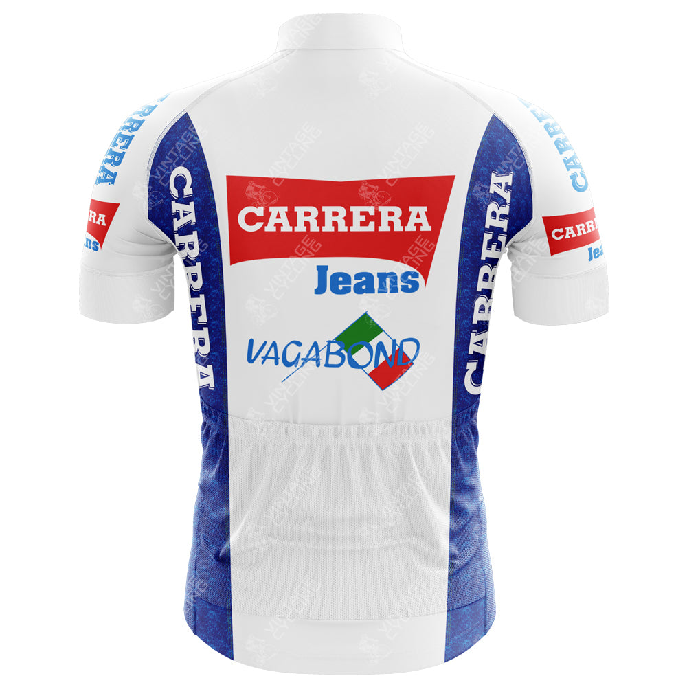 The Carrera Jeans 1987 Retro Cycling Jersey features a back view with blue side panels, logos CARRERA in red, Jeans in blue, and Vagabond with a green and red diamond shape, channeling the classic style of the iconic Stephen Roche era.