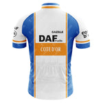 The DAF Trucks Retro Cycling Jersey showcases a rear view in blue and white with DAF Trucks and Cote dOr logos. Crafted from lightweight polyester, it features orange stripes and Gazelle text on the upper back for a classic touch.