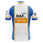 The DAF Trucks Retro Cycling Jersey showcases a rear view in blue and white with DAF Trucks and Cote dOr logos. Crafted from lightweight polyester, it features orange stripes and Gazelle text on the upper back for a classic touch.