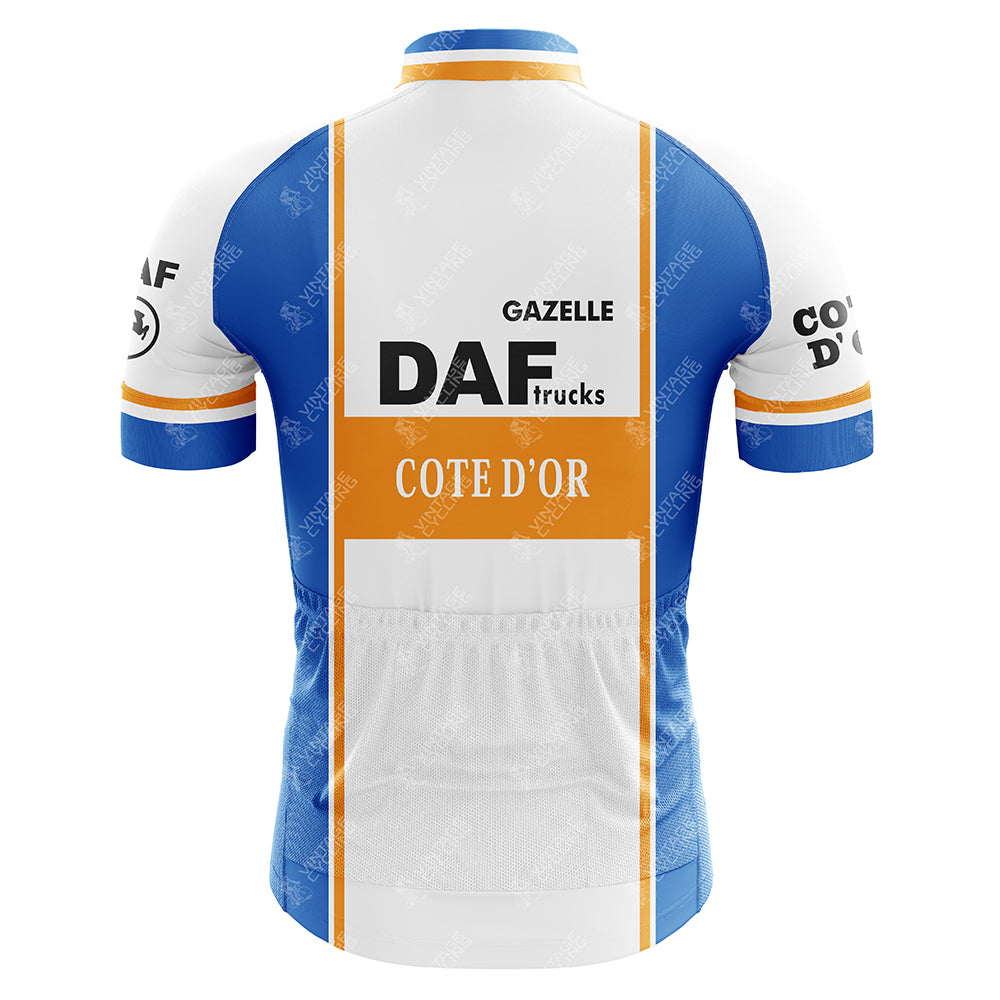 The DAF Trucks Retro Cycling Jersey showcases a rear view in blue and white with DAF Trucks and Cote dOr logos. Crafted from lightweight polyester, it features orange stripes and Gazelle text on the upper back for a classic touch.