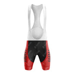 The red, black, and white cycling bib short evokes a FAEMA-inspired design with a white upper and shoulder straps. Its red and black lower part features vertical text on the left leg, perfectly complementing the FAEMA Red and White Retro Short Sleeve Cycling Set.