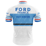 The Ford France Hutchinson Retro Cycling Jersey features a back view in white and light blue with bold FORD FRANCE and HUTCHINSON. It has lightweight polyester, blue and red striped sleeves, and the Ford logo on the shoulders.