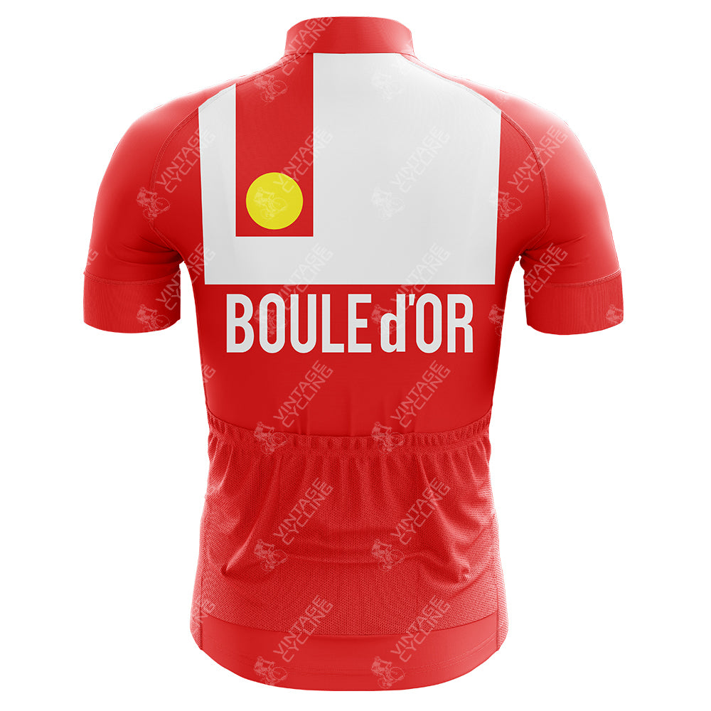 The Freddy Maertens 1981 Boule d’Or Sunair Retro Cycling Jersey features a lightweight polyester fabric with a red design, a white vertical stripe, and a yellow circle on the back. It has BOULE dOR printed in white, capturing the classic style of Freddy Maertens.