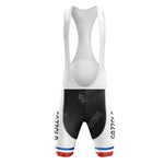 Back view of LA REDOUTE Retro Short Sleeve Cycling Set with a white top and black shorts featuring vintage blue and red hem stripes. SYNERGY CYCLES is subtly visible on the fabric.