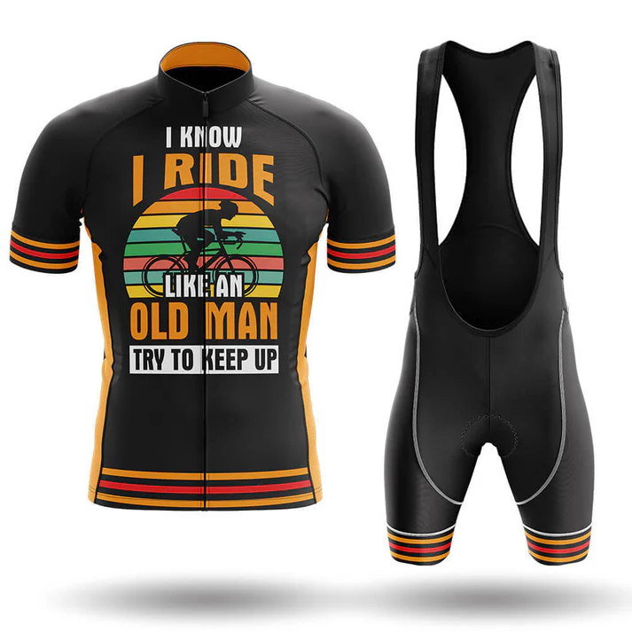 The Dawgs Short Sleeve Cycling Set includes a black jersey and bib shorts with orange and yellow stripes, featuring “I know I ride like an old man. Try to keep up” and a cyclist graphic on a retro sunset background.