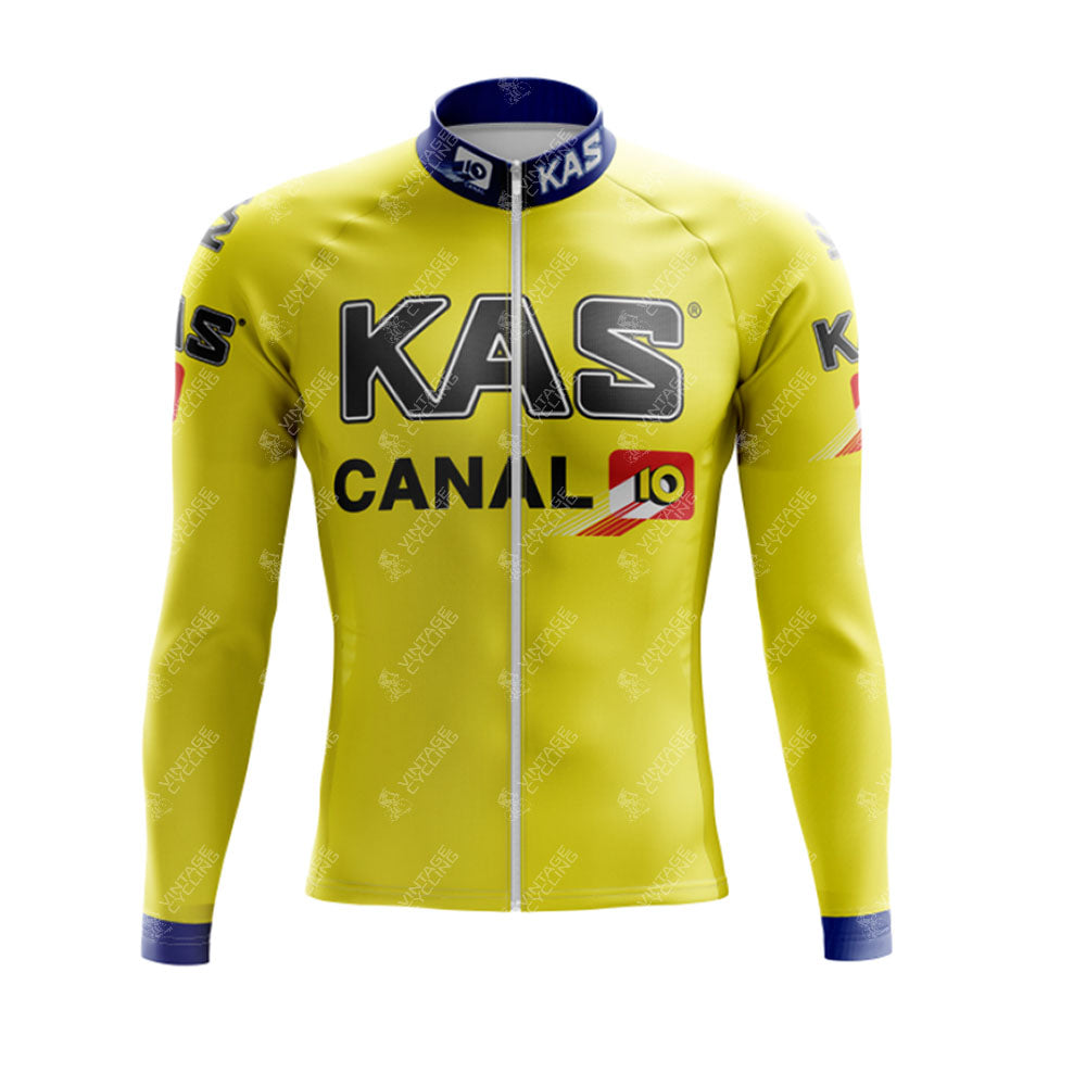 The KAS Retro Long Sleeve Cycling Set includes a yellow jersey with KAS and CANAL 10 logos, blue collar accents, and matching cuffs. It features a front zipper closure and offers a cozy fleece option for cooler rides.