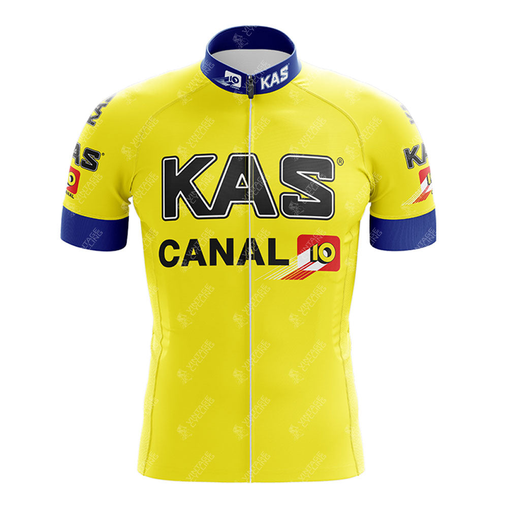 The KAS Retro Short Sleeve Cycling Set features a jersey with KAS and CANAL 10 logos, blue collar and sleeve accents, logos on the sleeves and chest, and a front zipper. Pair it with the matching shorts for a classic cycling style.