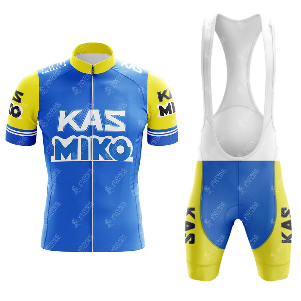 The KAS V1 Retro Short Sleeve Cycling Set features a blue and yellow jersey with KAS MIKO on the front, short sleeves, and a zipper. The matching bib shorts also display the text on the legs and have stylish white straps.