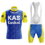 The KAS V2 Retro Short Sleeve Cycling Set includes a blue jersey with yellow sleeves, featuring KAS Kaskol in white, and matching bib shorts. Check our sizing guide for the perfect fit.