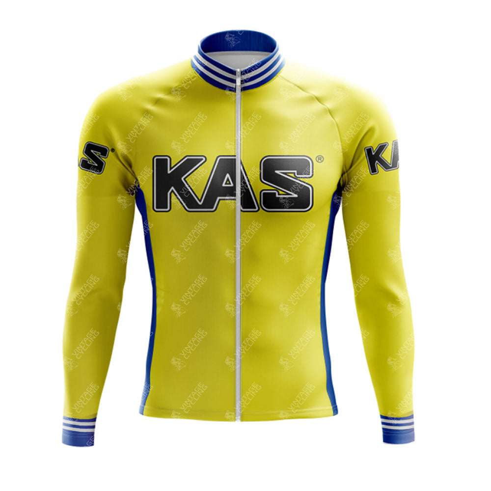 The KAS Yellow Retro Long Sleeve Cycling Set features KAS in bold black on the chest and sleeves, with breathable material, blue and white striped cuffs, a collar, and a front zipper. A stylish cycling choice with optional fleece lining.